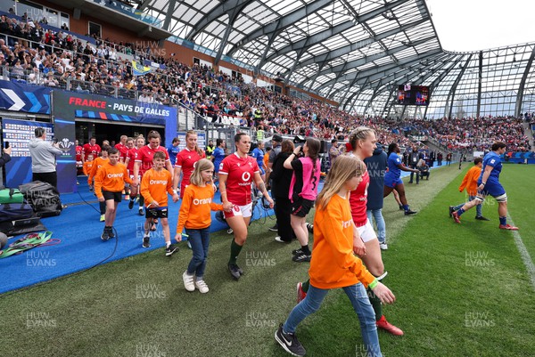 230423 - France v Wales, TicTok Women’s 6 Nations - Hannah Jones of Wales leads the team out at the start of the match