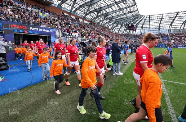 230423 - France v Wales, TicTok Women’s 6 Nations - Hannah Jones of Wales leads the team out at the start of the match