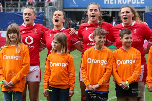 230423 - France v Wales, TicTok Women’s 6 Nations - Hannah Jones, Ffion Lewis, Lisa Neumann and Gwenllian Pyrs of Wales up for the anthem at the start of the match