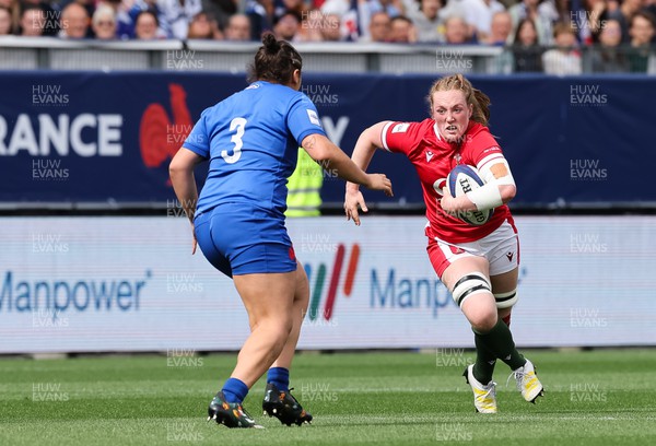 230423 - France v Wales, TicTok Women’s 6 Nations - Abbie Fleming of Wales takes on Assia Khalfaoui of France 