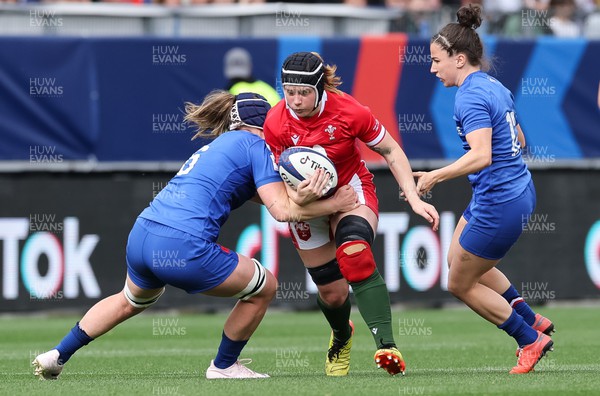 230423 - France v Wales, TicTok Women’s 6 Nations - Bethan Lewis of Wales takes on Charlotte Escudero of France 