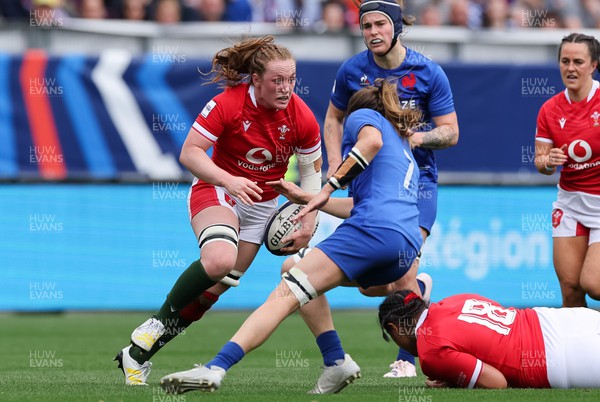 230423 - France v Wales, TicTok Women’s 6 Nations - Abbie Fleming of Wales takes on Gaelle Hermet of France 