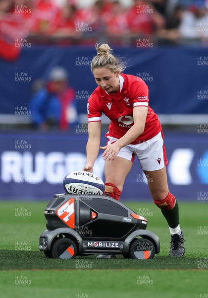 230423 - France v Wales, TicTok Women’s 6 Nations - Elinor Snowsill of Wales takes the ball from the radio controlled car to start the second half