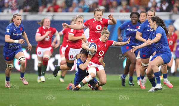 230423 - France v Wales, TicTok Women’s 6 Nations - Keira Bevan of Wales is tackled
