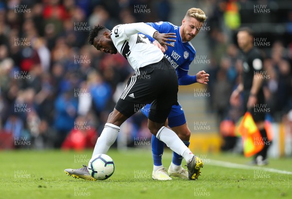 270419 - Fulham v Cardiff City, Premier League - Joe Bennett of Cardiff City challenges Andre-Frank Zambo Anguissa of Fulham for the ball