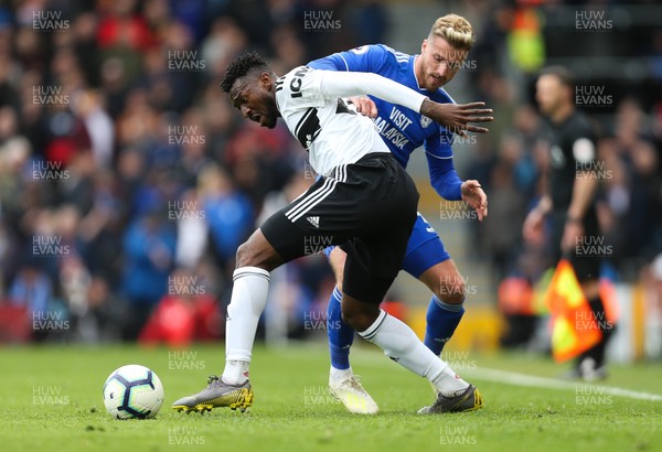 270419 - Fulham v Cardiff City, Premier League - Joe Bennett of Cardiff City challenges Andre-Frank Zambo Anguissa of Fulham for the ball