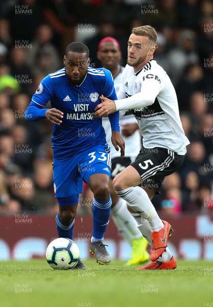 270419 - Fulham v Cardiff City, Premier League - Junior Hoilett of Cardiff City shrugs off the challenge from Calum Chambers of Fulham