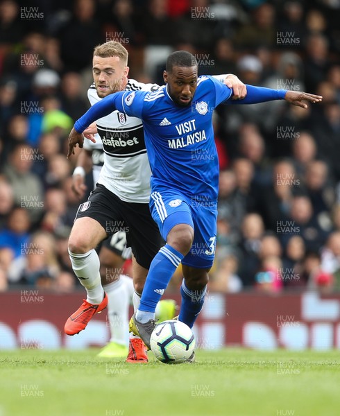 270419 - Fulham v Cardiff City, Premier League - Junior Hoilett of Cardiff City shrugs off the challenge from Calum Chambers of Fulham
