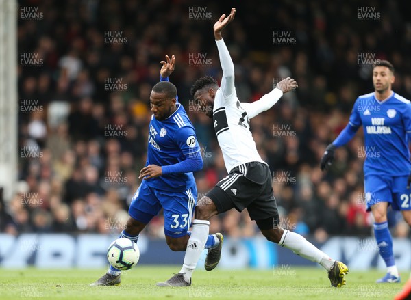 270419 - Fulham v Cardiff City, Premier League - Junior Hoilett of Cardiff City is tackled by Andre-Frank Zambo Anguissa of Fulham