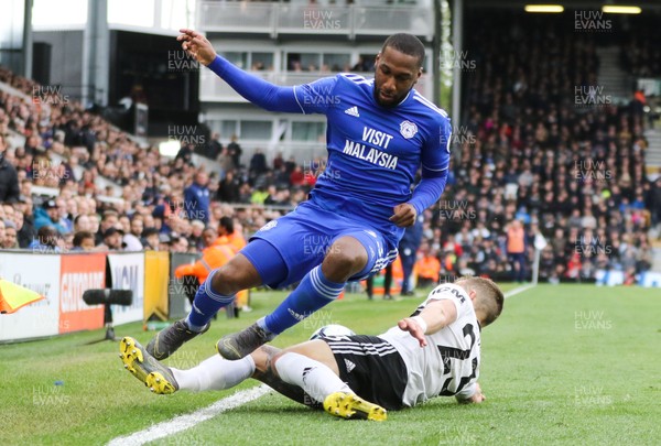 270419 - Fulham v Cardiff City, Premier League - Junior Hoilett of Cardiff City is tackled by Joe Bryan of Fulham
