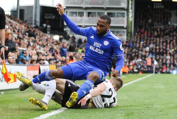 270419 - Fulham v Cardiff City, Premier League - Junior Hoilett of Cardiff City is tackled by Joe Bryan of Fulham