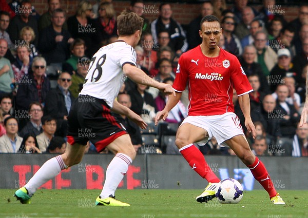 280913 - Fulham vs Cardiff City - Barclays Premier League - Peter Odemwigie of Cardiff goes past Scott Parker of Fulham(c) Huw Evans Agency