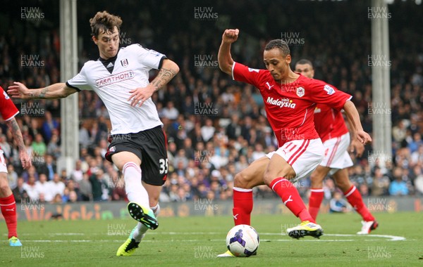 280913 - Fulham vs Cardiff City - Barclays Premier League - Peter Odemwingie of Cardiff takes on Fernando Amorebieta of Fulham(c) Huw Evans Agency