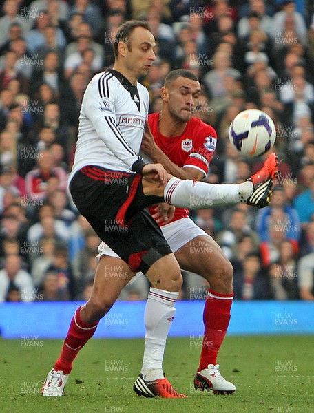 280913 - Fulham vs Cardiff City - Barclays Premier League - Dimitar Berbatov of Fulham and Steven Caulker of Cardiff(c) Huw Evans Agency