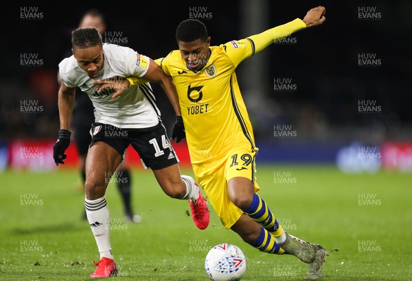 260220 - Fulham v Swansea City, Sky Bet Championship - Rhian Brewster of Swansea City is challenged by Bobby Decordova-Reid of Fulham
