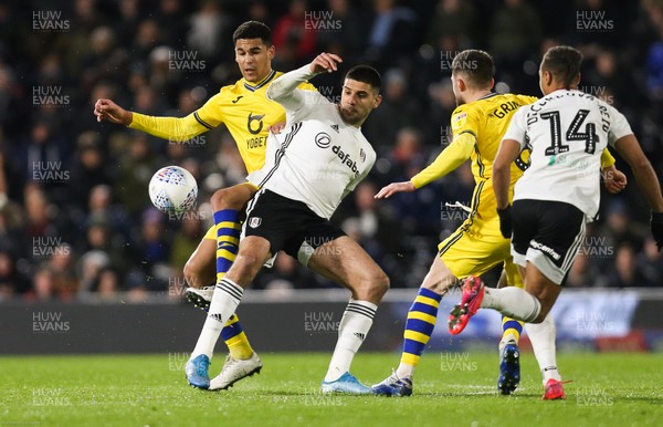 260220 - Fulham v Swansea City, Sky Bet Championship - Ben Cabango of Swansea City and Aleksandar Mitrovic of Fulham compete for the ball