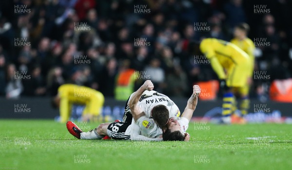260220 - Fulham v Swansea City, Sky Bet Championship - Harry Arter of Fulham and Joe Bryan of Fulham celebrate as Fulham score in the final minute of added time