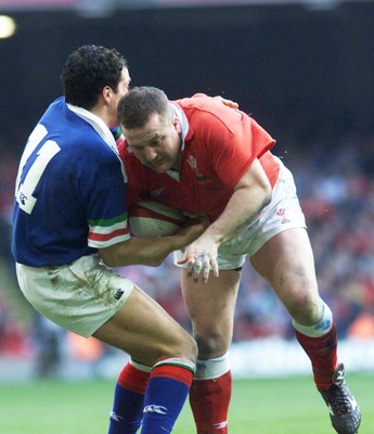 190299 - Wales v Italy - Wales' Garin Jenkins drives into Denis Dallan