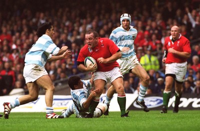 011099 - Wales v Argentina -Wales' Garin Jenkins is tackled by Manuel Contepomi