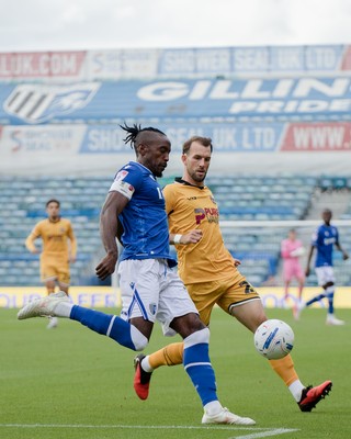 031026 - Gillingham v Newport County - Sky Bet League 2 - Omar Beckles of Gillingham and Christian Doidge of Newport County in action