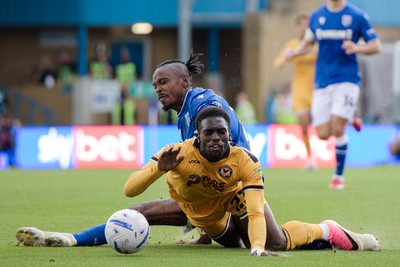 031026 - Gillingham v Newport County - Sky Bet League 2 - Michael Adu-Poku of Newport County and Omar Beckles of Gillingham in action
