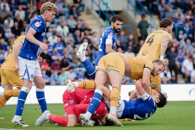 031026 - Gillingham v Newport County - Sky Bet League 2 - Cameron Norman of Newport County and Logan Dobbs of Gillingham in action