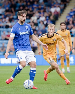 031026 - Gillingham v Newport County - Sky Bet League 2 - Robbie McKenzie of Gillingham and Matthew James Jacob of Newport County in action