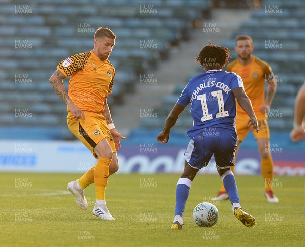 130819 - Gillingham v Newport County - Carabao Cup 1st Round -  Scot Bennett of Newport takes on Gillingham's Regan Charles-Cook 