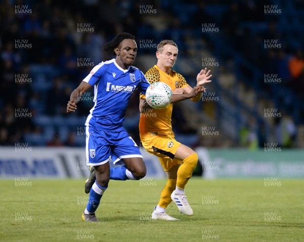 130819 - Gillingham v Newport County - Carabao Cup 1st Round -  Taylor Maloney of Newport is challenged by Gillingham's Regan Charles-Cook