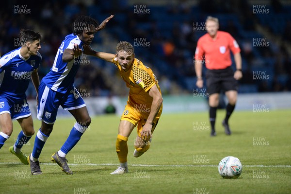 130819 - Gillingham v Newport County - Carabao Cup 1st Round -  Taylor Maloney of Newport is challenged by Gillingham's Regan Charles-Cook
