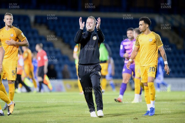 130819 - Gillingham v Newport County - Carabao Cup 1st Round -  Newport celebrate with manager Michael Flynn after the game