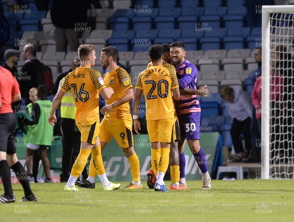 130819 - Gillingham v Newport County - Carabao Cup 1st Round -  Newport's hero goalkeeper Nick Townsend is congratulated after the shoot out