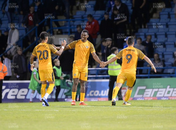 130819 - Gillingham v Newport County - Carabao Cup 1st Round -  Newport's Tristan Abrahams is congratulated after scoring the winning penalty in the shootout