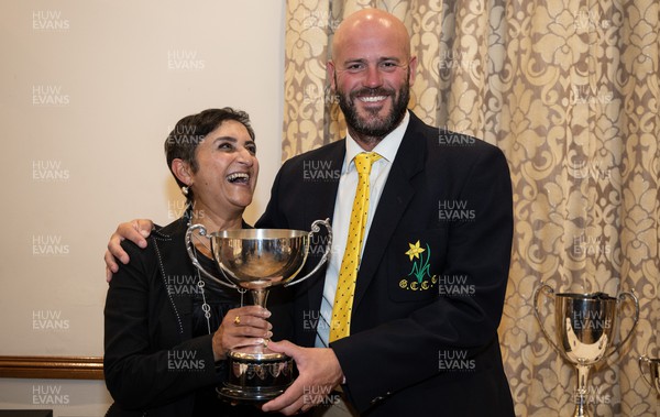 041023 - Glamorgan Cricket Club and St Helen’s Balconiers Combined Annual Awards Dinner, Towers Hotel, Swansea - Rina Shah Carlson receives the Glamorgan Player of the Year award on behalf of her son Kiran Carlson from David Harrison