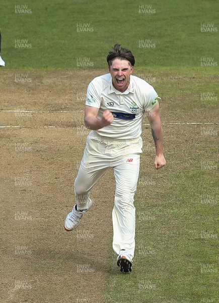 310321 Glamorgan v Cardiff UCCE, Pre-season Friendly - Dan Douthwaite of Glamorgan celebrates after taking the wicket of Thomas Bevan of Cardiff UCCE