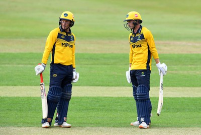 190822 - Glamorgan v Hampshire - Royal London Cup - Tom Bevan (right) of Glamorgan celebrates 50 with Colin Ingram