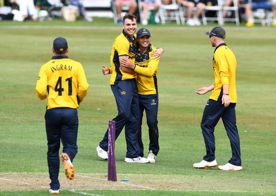 190822 - Glamorgan v Hampshire - Royal London Cup - Kiran Carlson of Glamorgan celebrates the wicket of Aneurin Donald with Joe Cooke