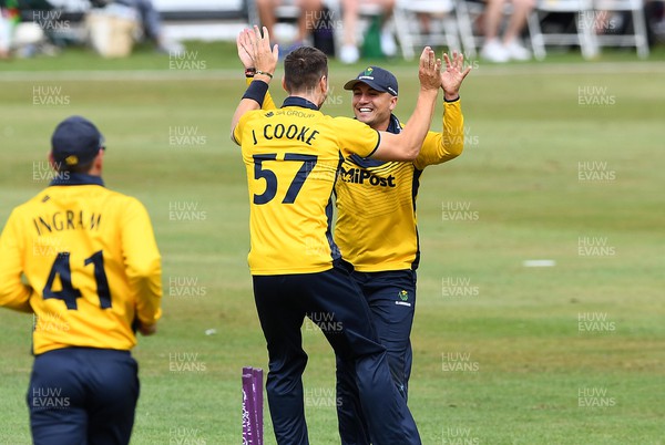 190822 - Glamorgan v Hampshire - Royal London Cup - Kiran Carlson of Glamorgan celebrates the wicket of Aneurin Donald with Joe Cooke