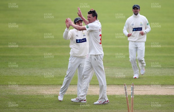 290319 - Glamorgan Inter Squad Game - Michael Hogan of Glamorgan celebrates taking a wicket with Andrew Salter