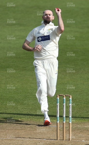 300321 Glamorgan v Cardiff UCCE, Pre-season Friendly - Jamie McIlroy of Glamorgan bowls
