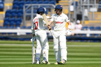 020525 - Glamorgan v Derbyshire - Rothesay County Championship - Zain Ul-Hassan congratulates Asa Tribe of Glamorgan after hitting 50