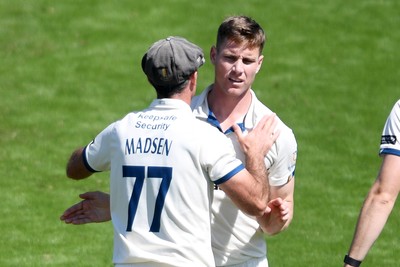 020525 - Glamorgan v Derbyshire - Rothesay County Championship - Luis Reece of Derbyshire celebrates with team mates after bowling out Asa Tribe of Glamorgan