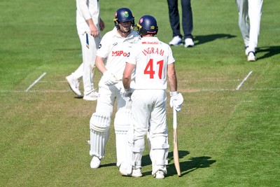 020525 - Glamorgan v Derbyshire - Rothesay County Championship - Sam Northeast of Glamorgan celebrates hitting 50 with Colin Ingram