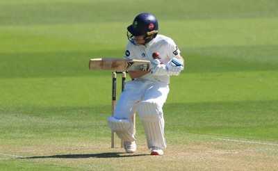 030525 - Glamorgan v Derbyshire, Rothesay County Championship Division 2, Day 2 - Andy Gorvin of Glamorgan reacts as his face guard is struck by the ball