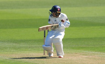 030525 - Glamorgan v Derbyshire, Rothesay County Championship Division 2, Day 2 - Andy Gorvin of Glamorgan reacts as his face guard is struck by the ball