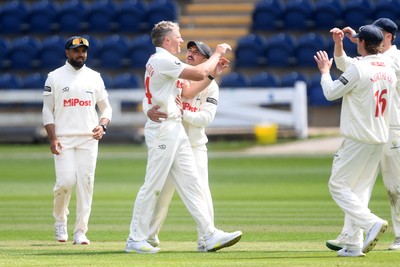 040525 - Glamorgan v Derbyshire - Rothesay County Championship - Timm Van Der Gugten of Glamorgan celebrates taking the wicket of Alex Thomson of Derbyshire with teammates