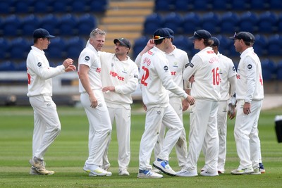 040525 - Glamorgan v Derbyshire - Rothesay County Championship - Timm Van Der Gugten of Glamorgan celebrates taking the wicket of Alex Thomson of Derbyshire with teammates