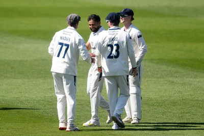 040525 - Glamorgan v Derbyshire - Rothesay County Championship - Sam Northeast of Glamorgan is bowled out by Anuj Dal of Derbyshire and celebrates with team mates