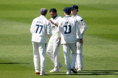040525 - Glamorgan v Derbyshire - Rothesay County Championship - Sam Northeast of Glamorgan is bowled out by Anuj Dal of Derbyshire and celebrates with team mates