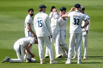 040525 - Glamorgan v Derbyshire - Rothesay County Championship - Sam Northeast of Glamorgan is bowled out by Anuj Dal of Derbyshire and celebrates with team mates